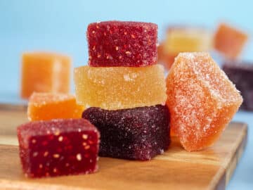 A colorful traditional French fruit jellies (Pâte de fruits). It's a sweet dessert which is main ingredients are concentrate fruits paste, sugar and pectin surrounding with sugar crystal